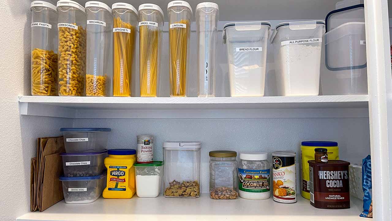 Organized pantry with clear containers and labels.