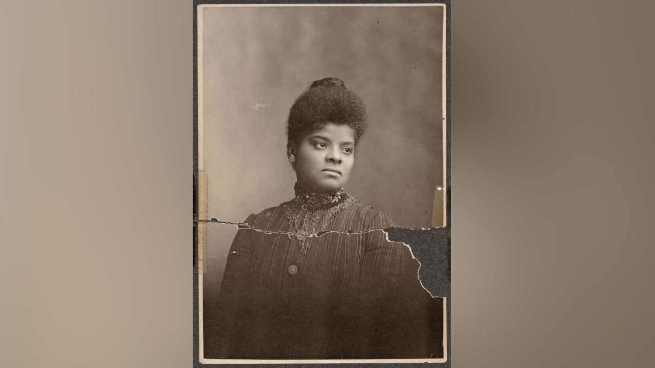 Black and white photo of Ida B. Well. looking determines and powerful.